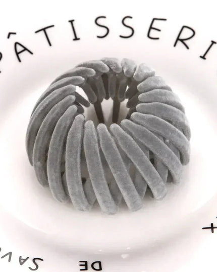 #7E7C7B